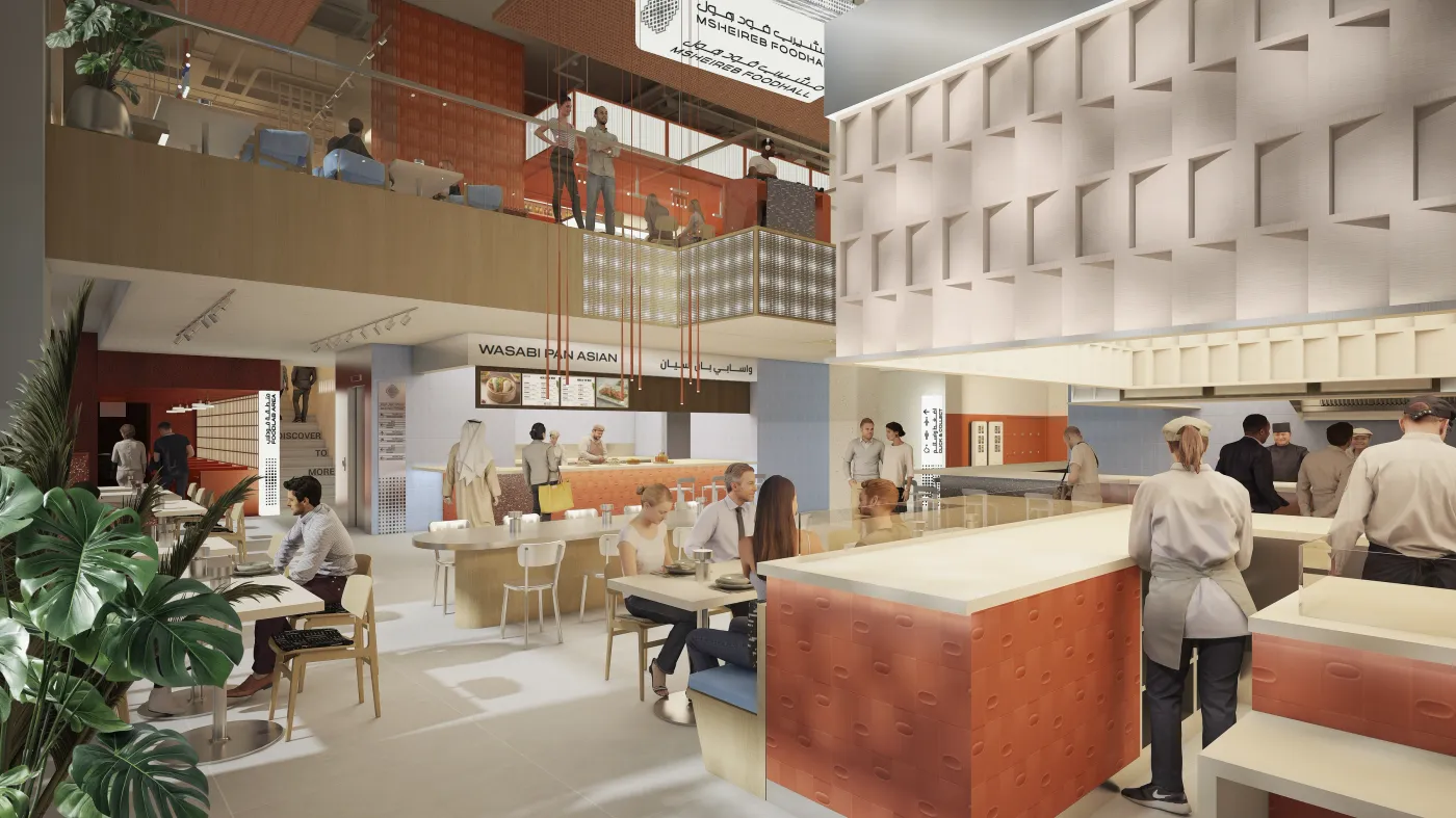 The Msheireb Foodhall interior, looking across the seating toward the stall counters and the mezzanine above